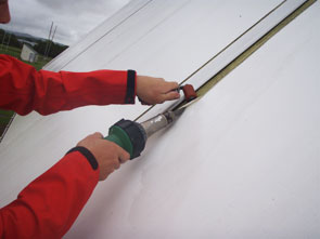 Clean and Repair of Tensioned Fabric Structure Repairing the fabric