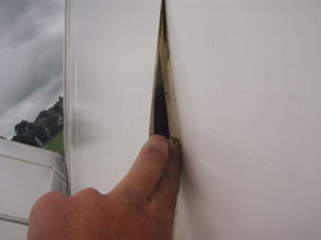 Clean and Repair of Tensioned Fabric Structure The damaged fabric